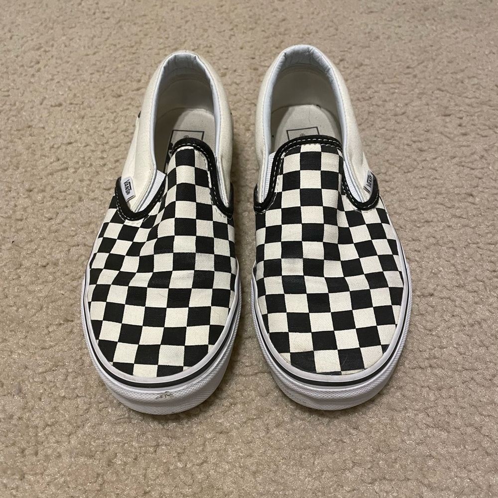 Pair of black and white checkered Vans women’s size 7